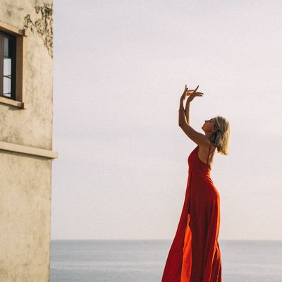 Silhouette of a person in a balancing pose.